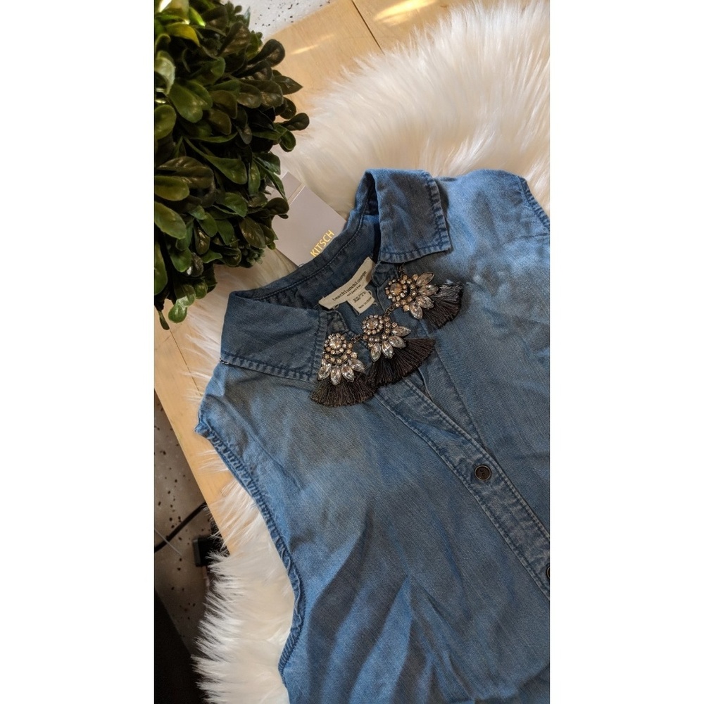 Chambray sleeveless button down.
